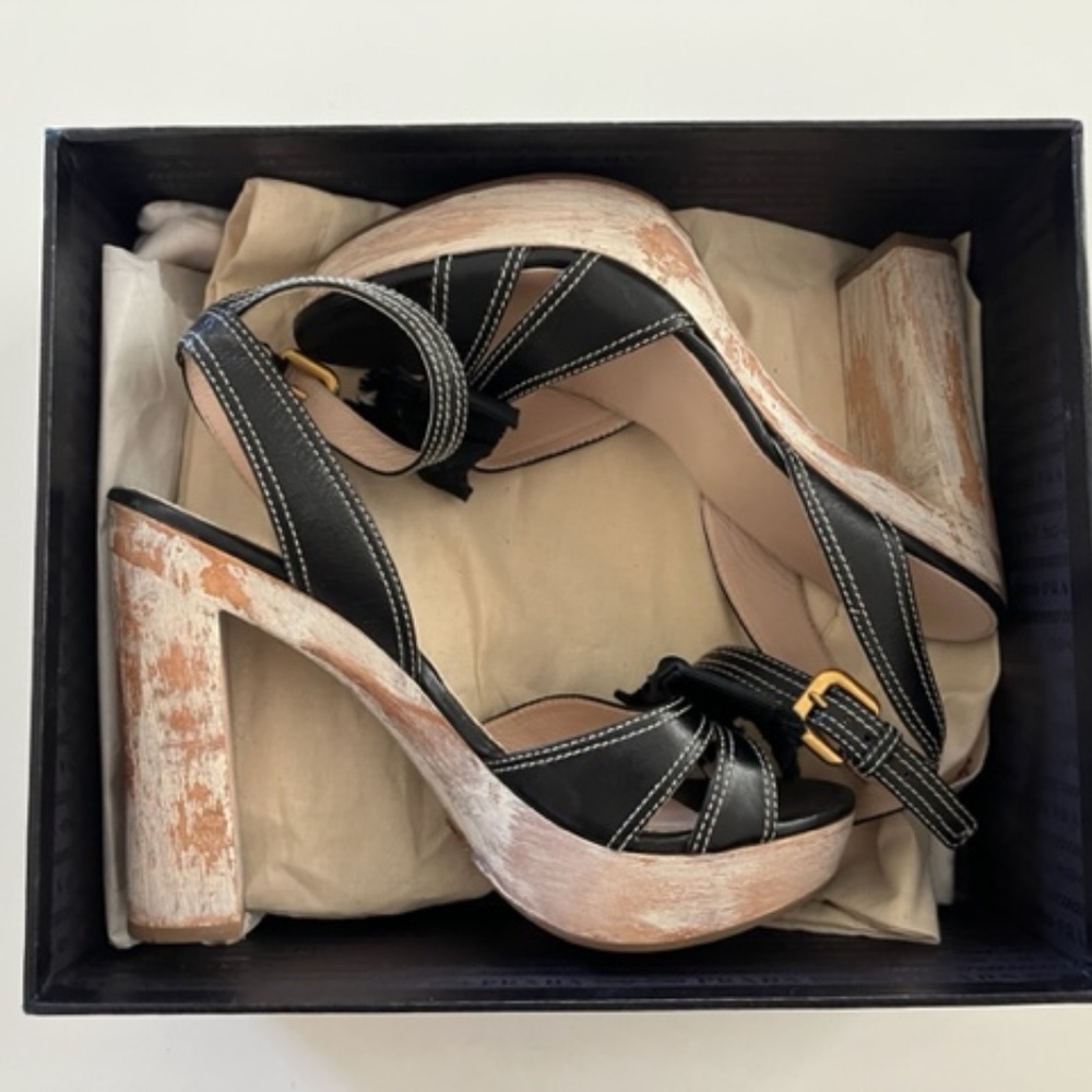 PRADA Bow distressed wooden heels.
